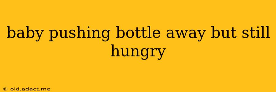 baby pushing bottle away but still hungry