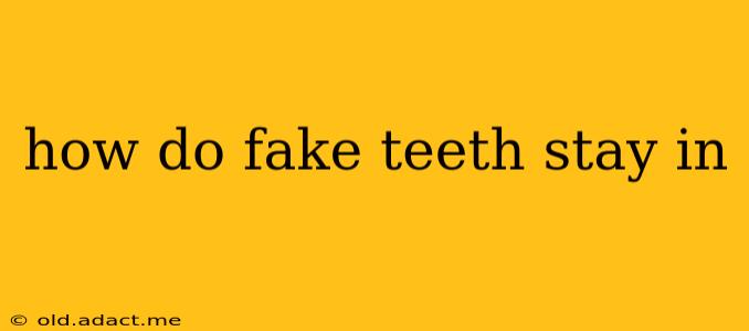 how do fake teeth stay in
