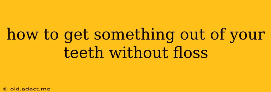 how to get something out of your teeth without floss