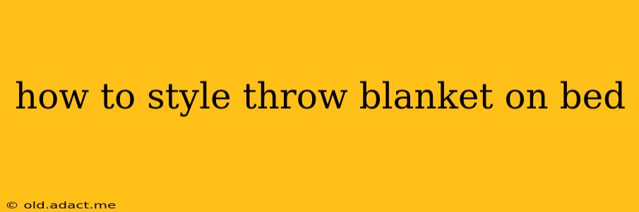 how to style throw blanket on bed