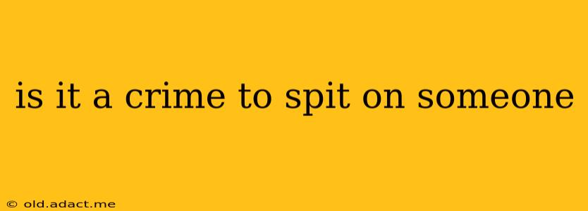 is it a crime to spit on someone